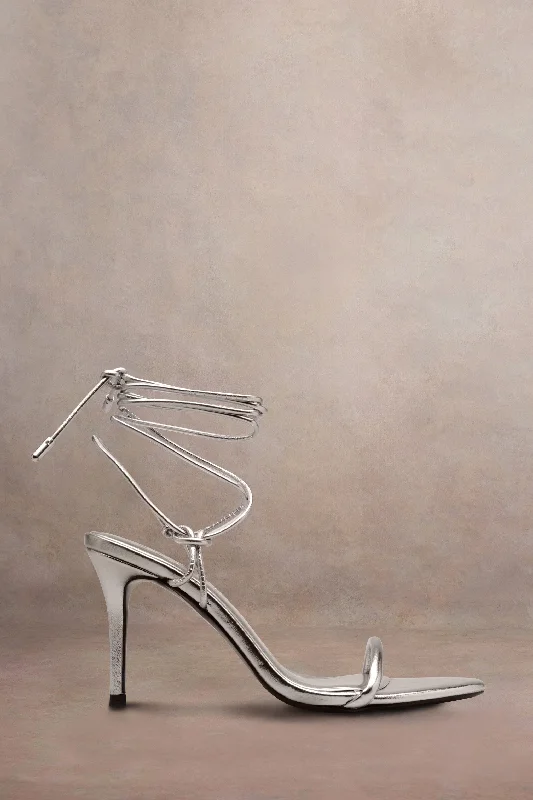 Elegant and sophisticated women's shoes for dinner datesCrossed Wires | Silver Metallic Lace-Up Heeled Sandals