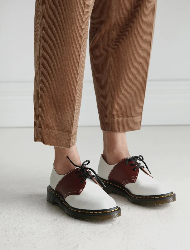 Chic and minimalist women's footwear trendsDr. Martens Mie Saddle Shoe Cherry/White